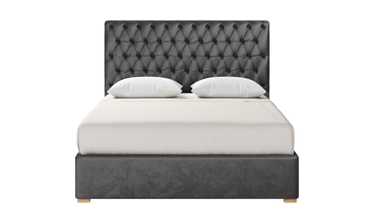 Bed frame with quilted outlet headboard